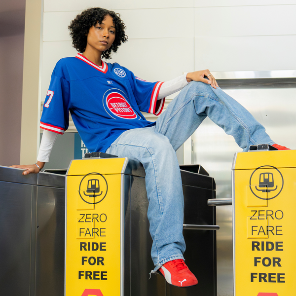 Model Wearing Detroit Pistons Starter Football Jersey in Blue - Front View