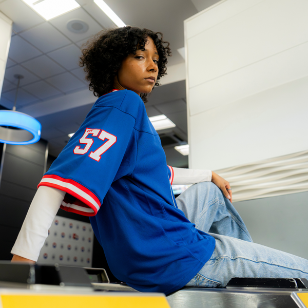 Model Wearing Detroit Pistons Starter Football Jersey in Blue - Side View