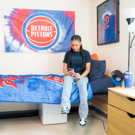Student Wearing Detroit Pistons Fundamentals Navy T-Shirt