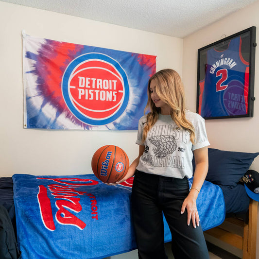 Blue and Red Wincraft Pistons 3x5 Deluxe Tie Dye Flag Hung in Dorm