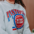 Model Wearing Detroit Pistons Vintage Collection Stacked Crewneck Sweatshirt - Graphic Detail