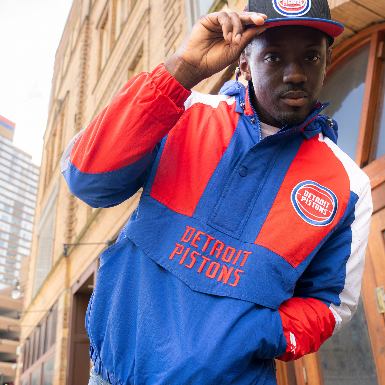 Model Wearing Starter Pistons Body Check Jacket in Blue and Red - Font View