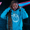 Model wearing 2025-26 City Edition Detroit Pistons Nike Teal Club Fleece Hoodie