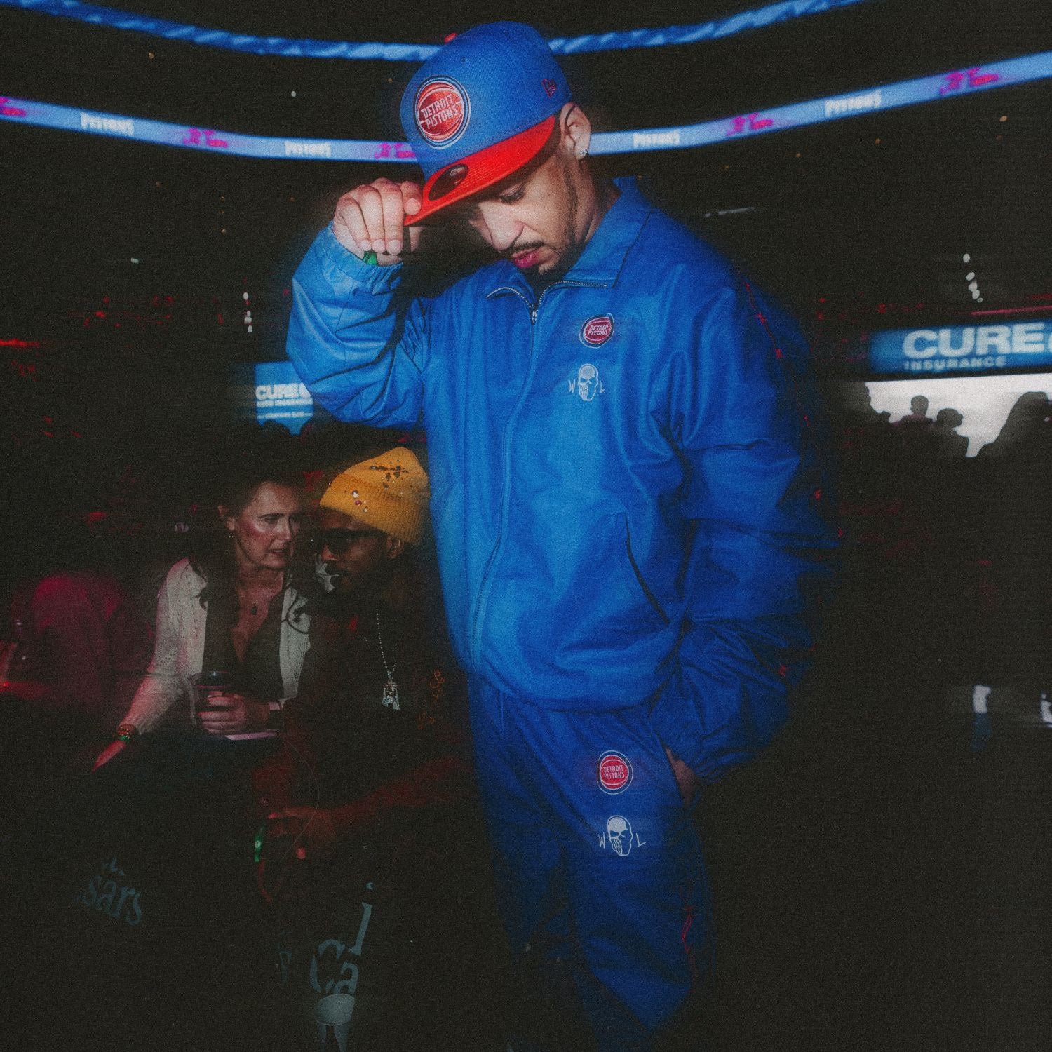 Model Wearing Warren Lotas x Detroit Pistons Barbed Wire Full Zip Jacket and Warren Lotas x Detroit Pistons Barbed Wire Pants