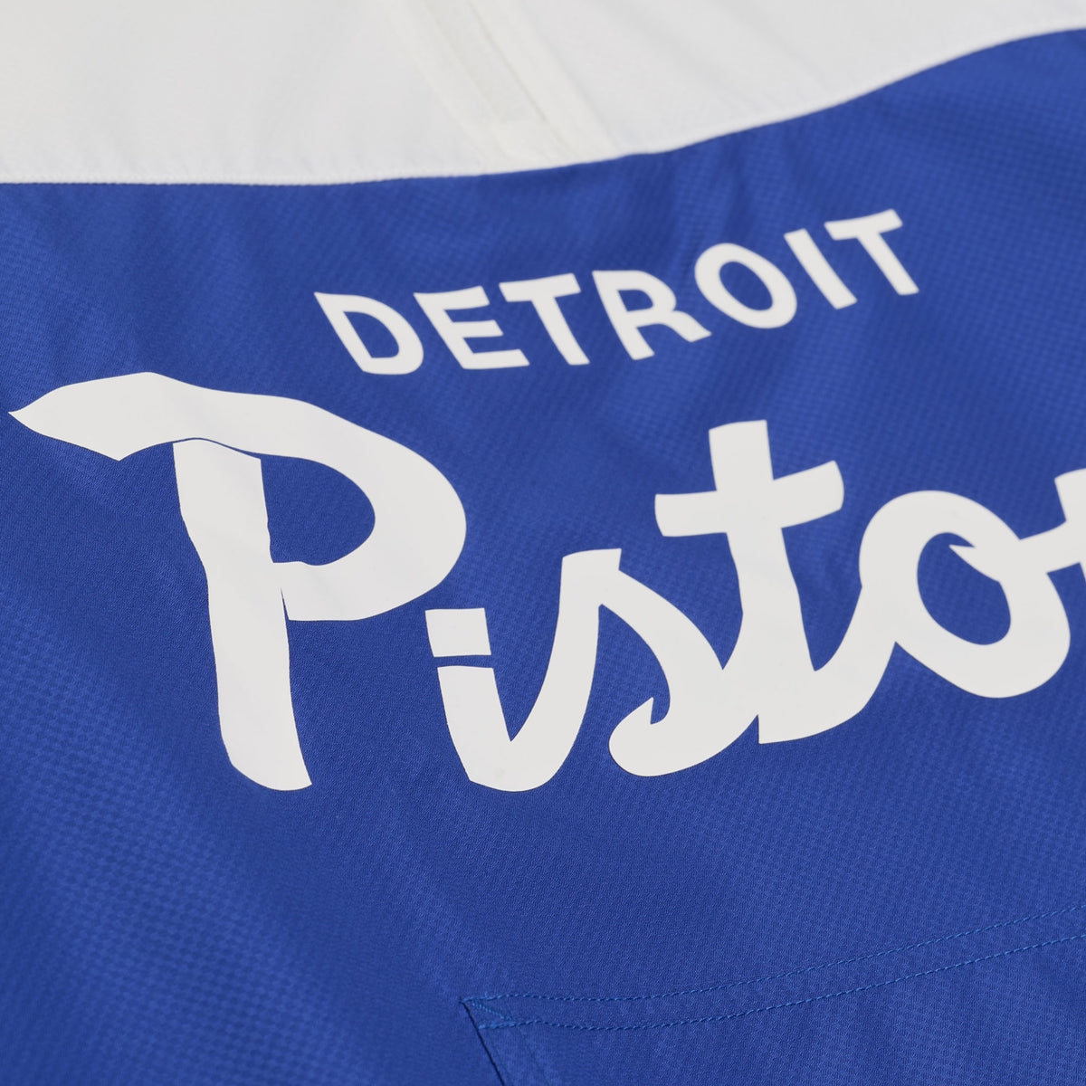 Detroit Pistons Mitchell & Ness Head Coach Anorak 1/2 Zip Jacket in White and Blue - Front View