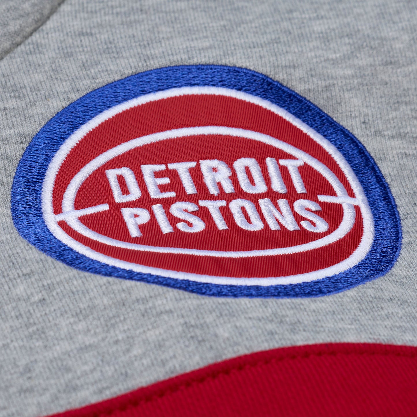 Detroit Pistons Mitchell & Ness Head Coach Hoodie in Grey, Blue, and Red - Chest Logo View
