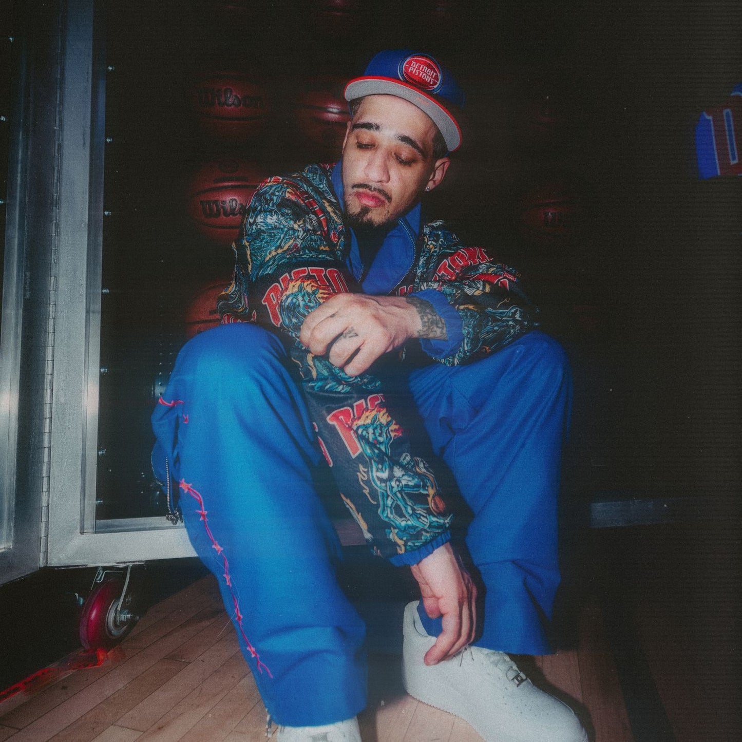 Model Wearing Warren Lotas x Detroit Pistons Barbed Wire Full Zip Jacket and Warren Lotas x Detroit Pistons Barbed Wire Pants