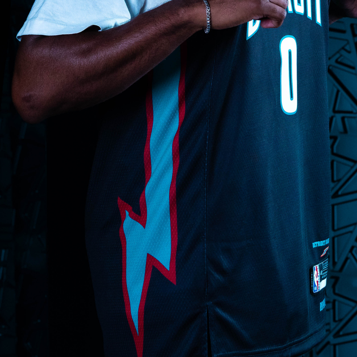 Side panels for the jersey and shorts feature the iconic lightning bolts, reminiscent of Detroit Basketball in the '70's and '80's.