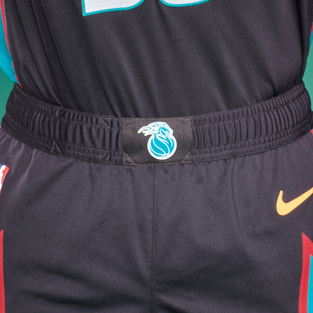 Centered on the shorts' waistline is the alternate Flaming Horse Pistons logo of the '90's and '00's.